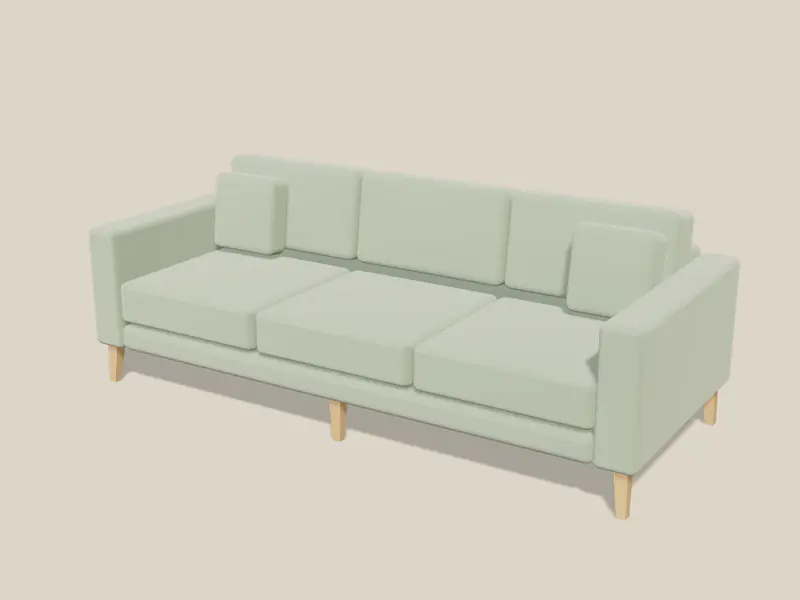 En tresetes sofa med rette armlener i salvegrønn fløyel på avsmalnende eikeben, i et lyst studio.